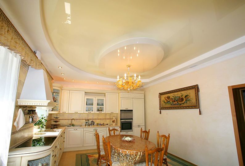Бежевый глянцевый натяжной потолок на кухне - фото